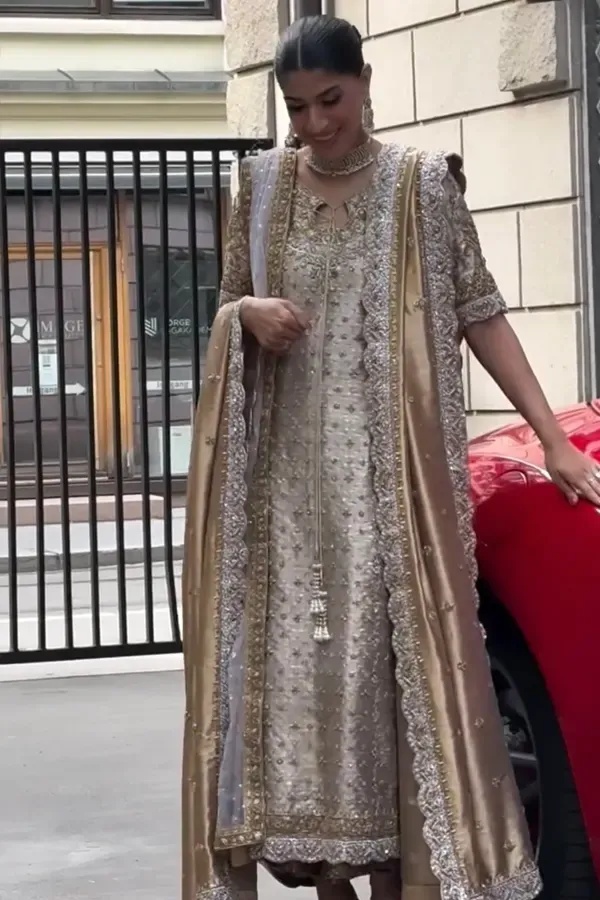 Noor- e- Haseen pakistani fashion outfit in gold, silver tones.